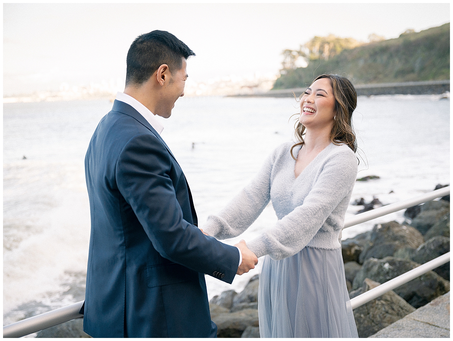 Romantic San Francisco engagement photo in front of the Golden Gate Bridge at Crissy Field.