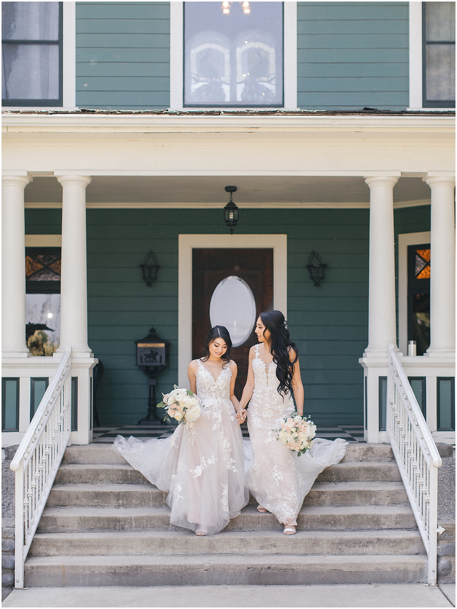 Brides share a joyful moment at their whimsical garden wedding in Southern California.
