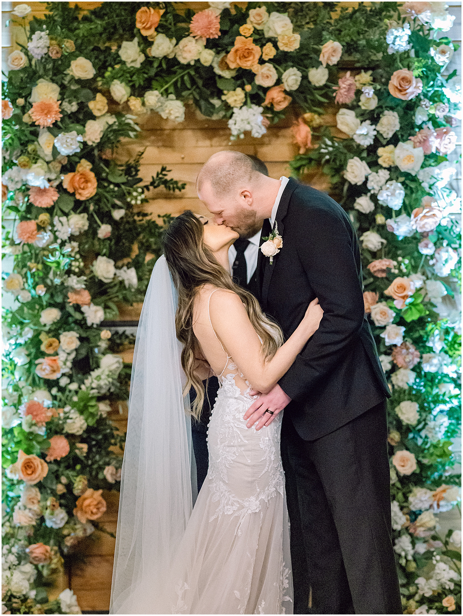 Elegant mountain wedding ceremony at Serendipity Garden with soft winter florals.
