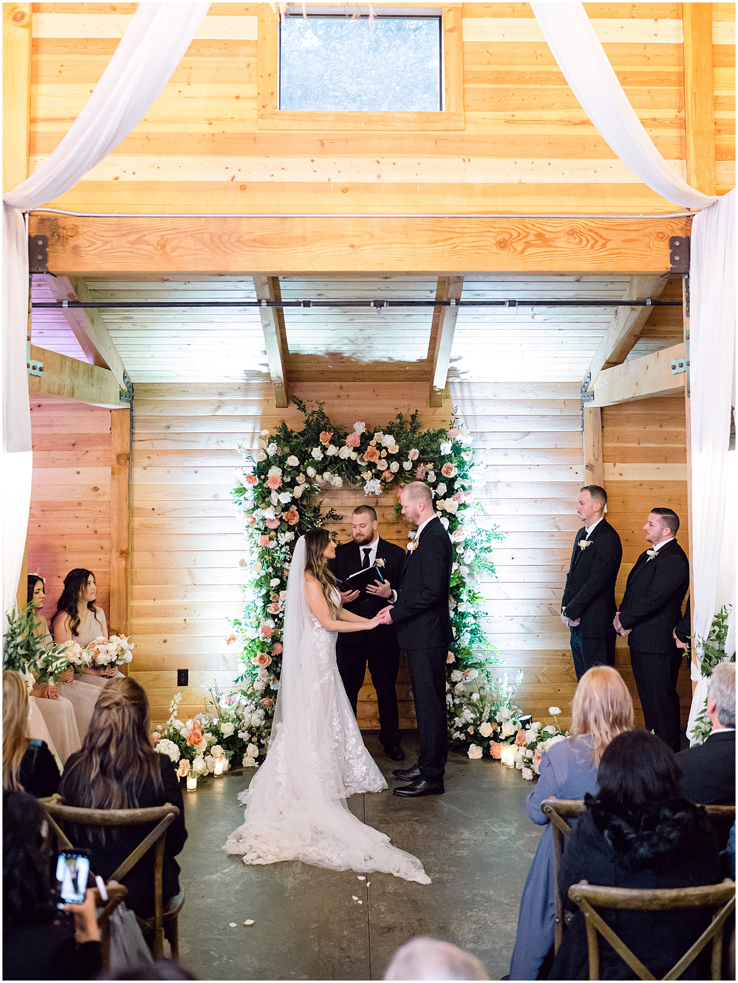 Elegant mountain wedding ceremony at Serendipity Garden with soft winter florals.