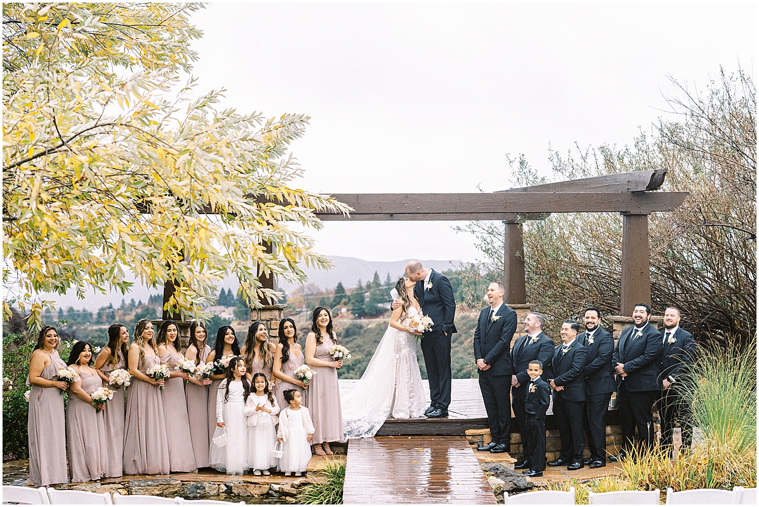 Elegant mountain wedding ceremony at Serendipity Garden with soft winter florals.