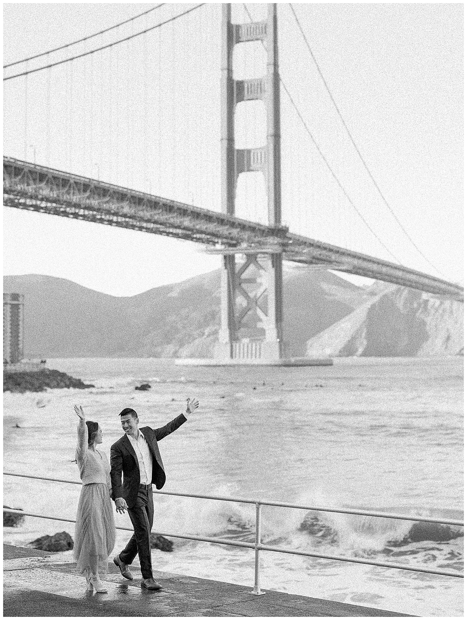 Romantic San Francisco engagement photo in front of the Golden Gate Bridge at Crissy Field.