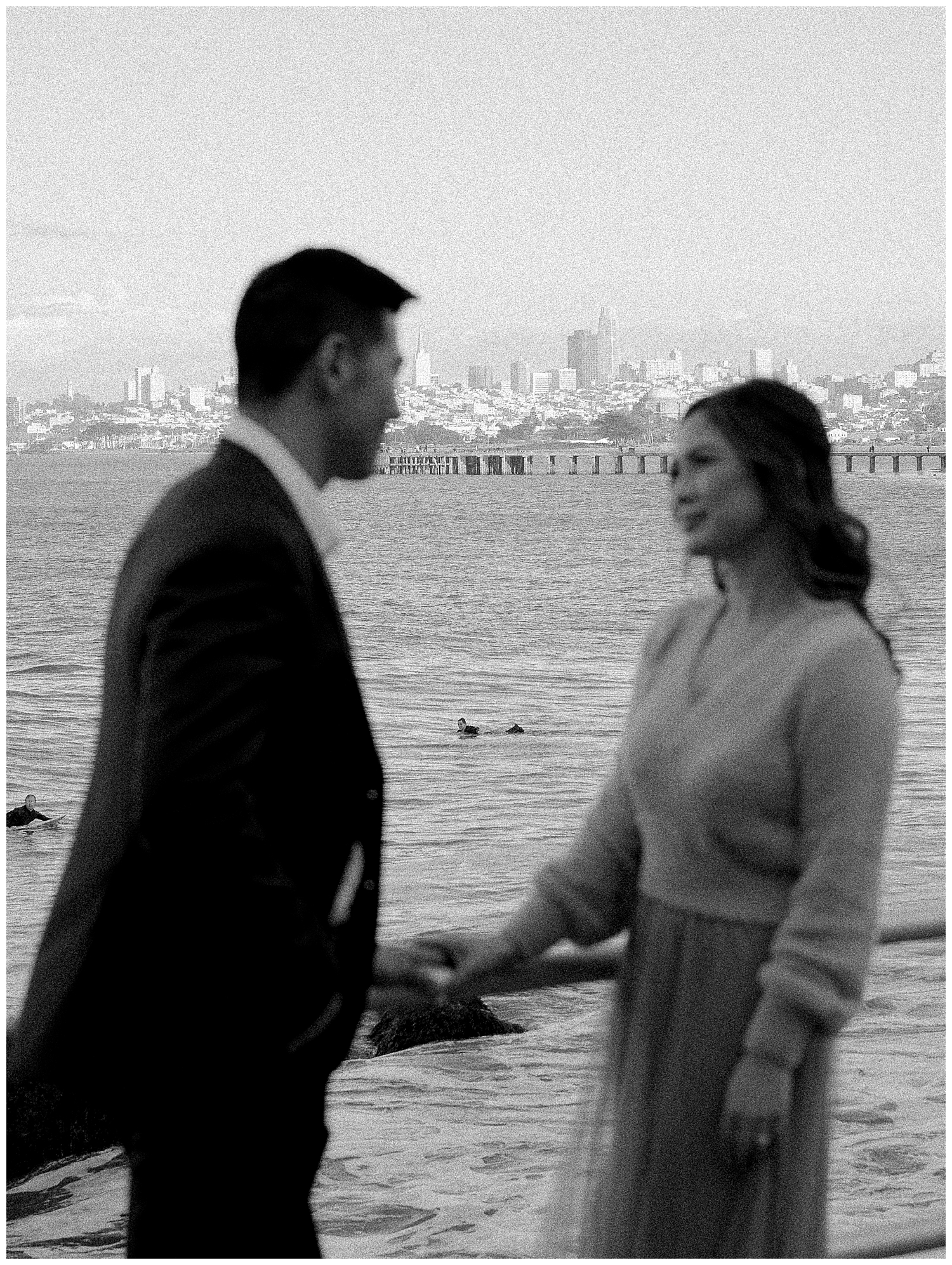 Romantic San Francisco engagement photo in front of the Golden Gate Bridge at Crissy Field.